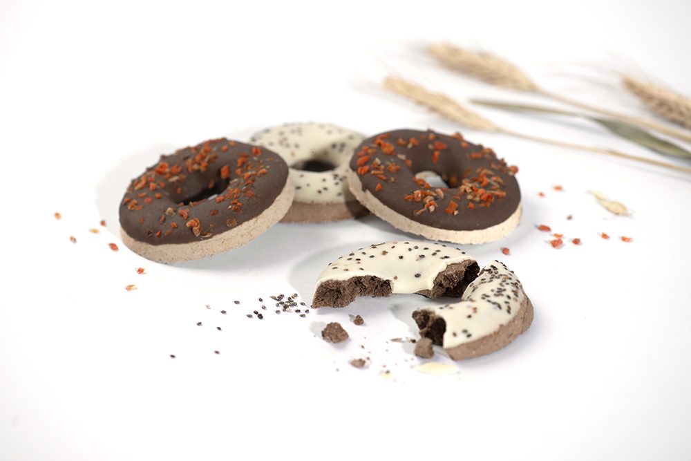 Chocolate and vanilla cookies with sprinkles on a white background