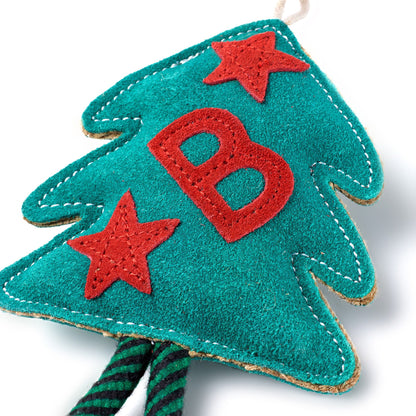 Suede Christmas tree doig toy with red letter 'B' and stars on a white background