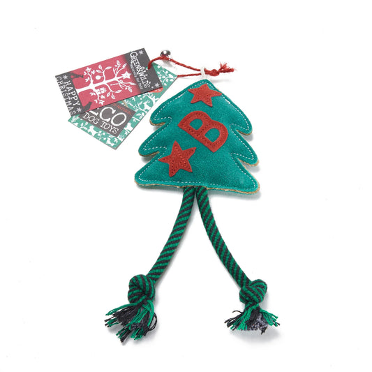Green tree-shaped dog toy with red letters and star, featuring a brand tag on a white background.
