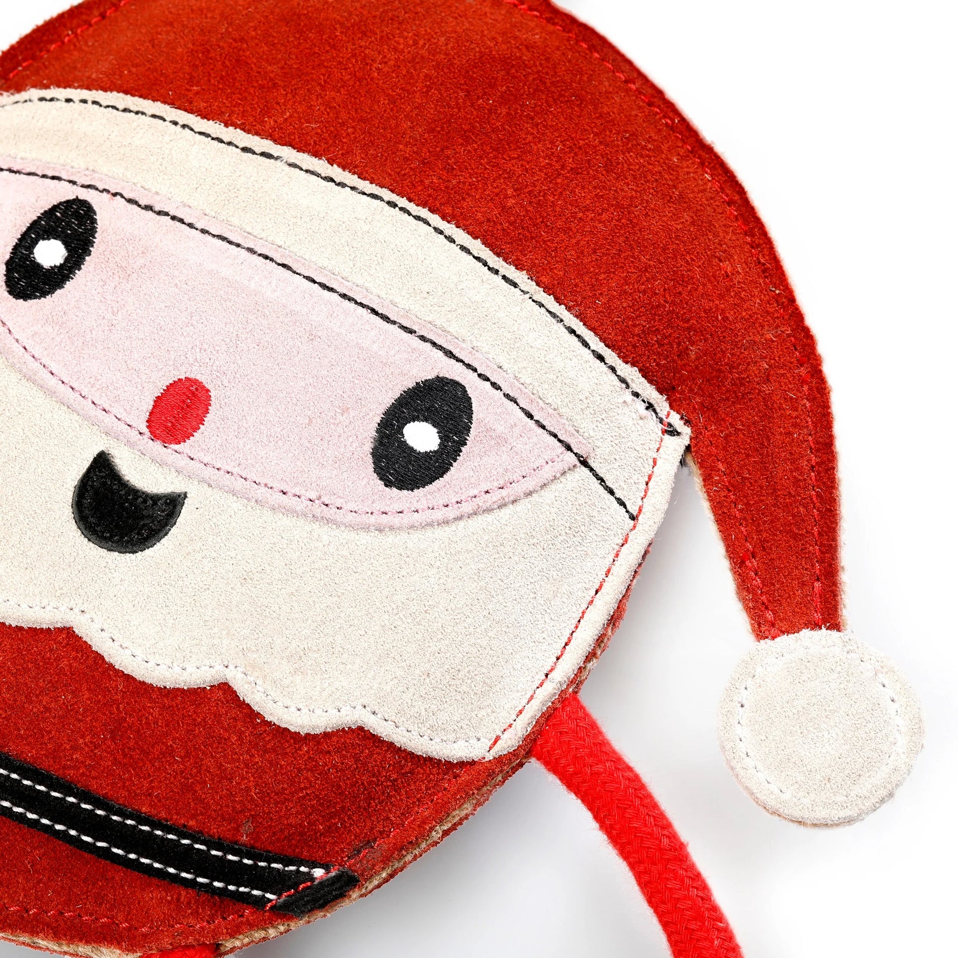 Close-up of a red plush toy resembling Santa Claus on a white background