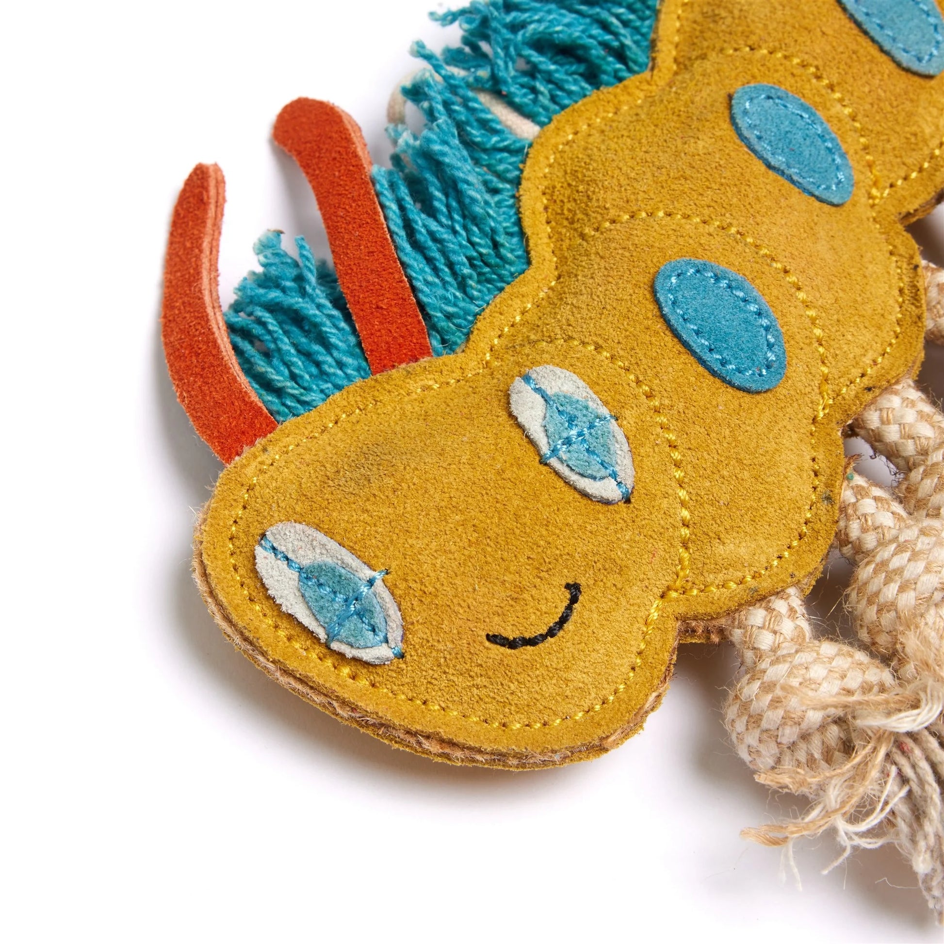 Toy with a smiling face, blue accents, and orange elements on a white background