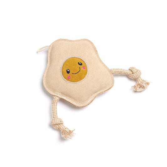 Toy resembling a fried egg with a smiling face on a white background