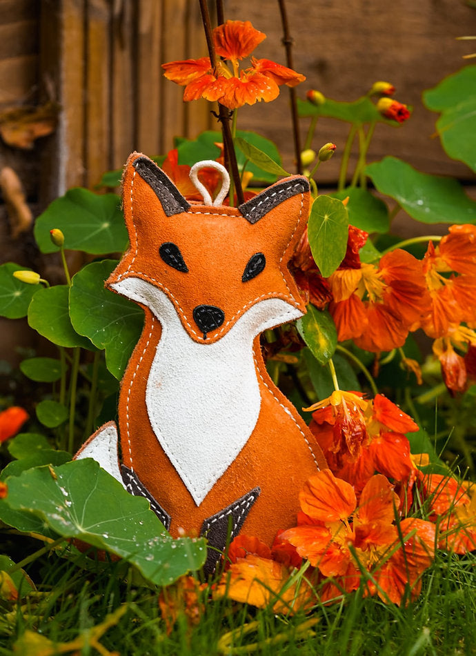 suede fox toy in grass